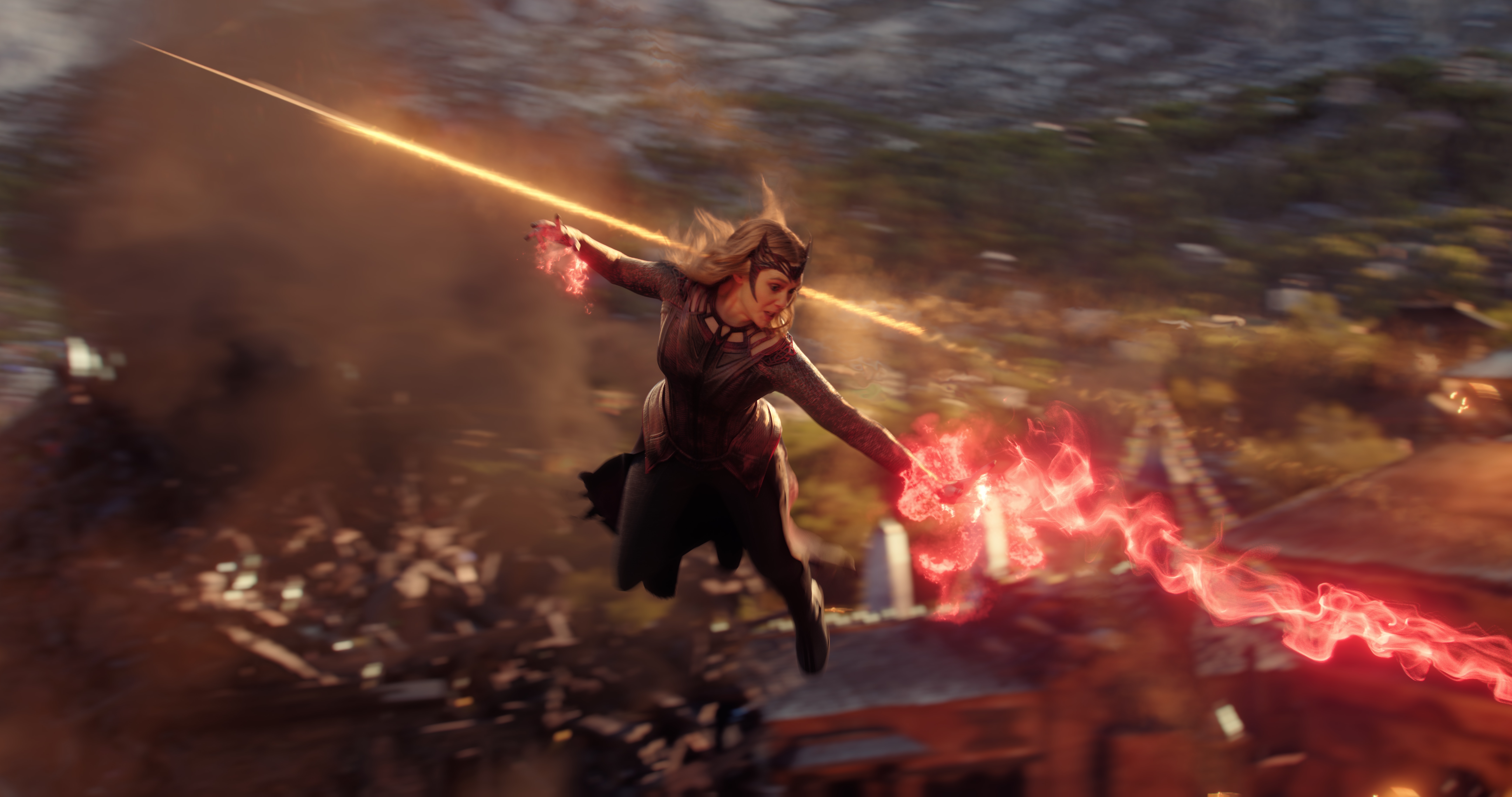 Scarlet Witch shoots a red beam of energy.